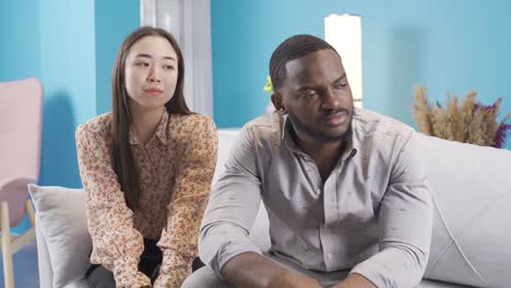 African-young-man-offended-at-his-Asian-girlfriend.